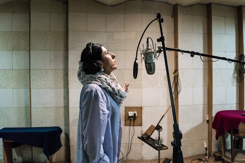 Iranian female singer Sayeh singing in the studio